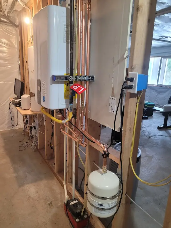 Licensed plumber repairing a kitchen sink in Otsego